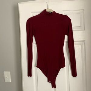 Red long sleeve body suit from Primark. Size small